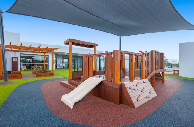 Timber play fort with slide